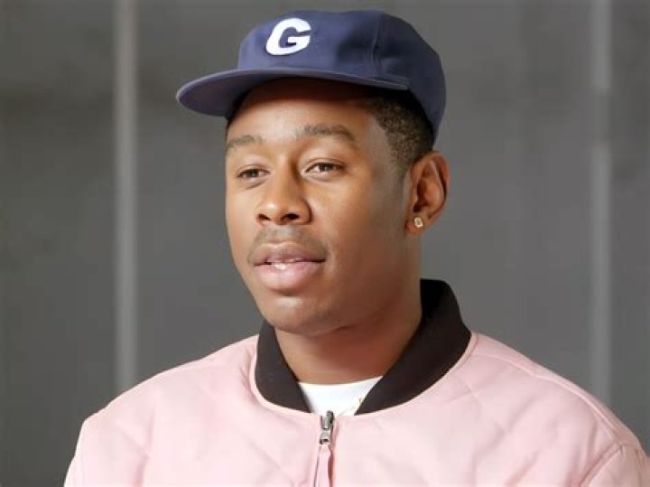 Tyler, the Creator and his mother accept the Best Rap Album award for
